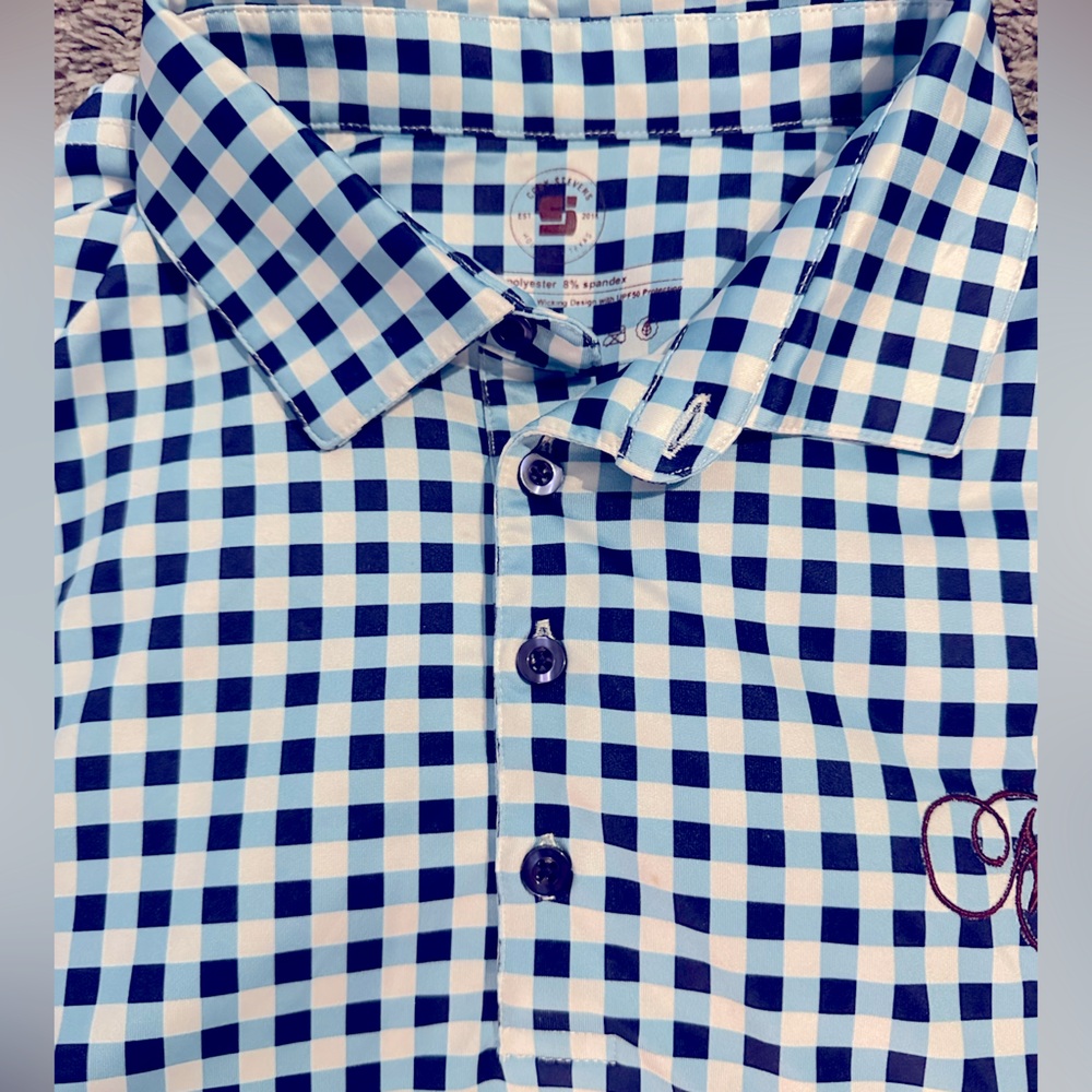 Cody Steven’s Blue polo shirt